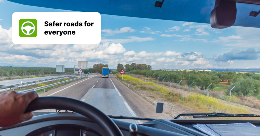 View from a truck driver's perspective on a highway, with a 'Safer roads for everyone' message, emphasising safe driving practices.