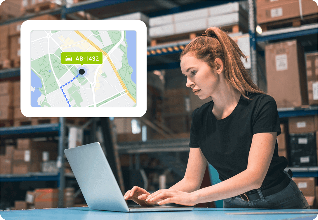 A woman working in a warehouse checks the Mapon fleet tracking system on her laptop and shares live GPS tracking links with a client awaiting delivery.