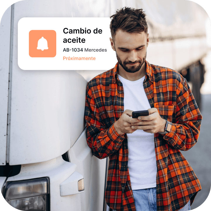Foto de una persona consultando el sistema de seguimiento de gestión de flotas Mapon en su teléfono. Se ve la notificación «Cambio de aceite».