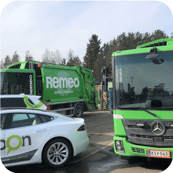 Mapon car parked next to Remeo waste management vehicles.