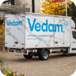 A Mapon client's Vedam.lv truck equipped with fleet camera systems parked outside.